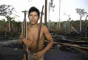 Tribal man holding bow and arrow